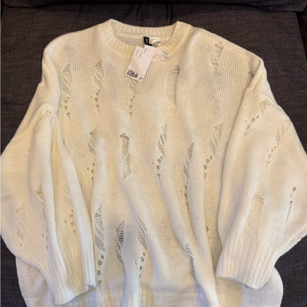 New with tags cream Divided sweater
